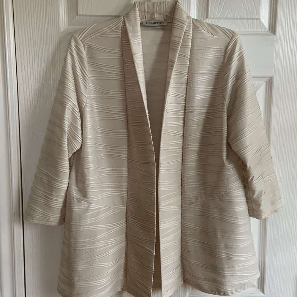 Champagne coloured light blazer. Unlined. Nice coverup for chilly summer nights